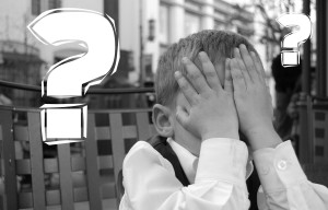 Canva - Kid Covering his Eyes Next to a Question Mark